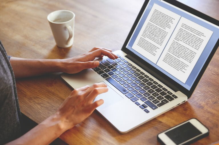 composing a blog on a laptop