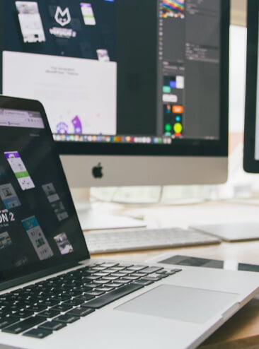 mac and macbook on a desk