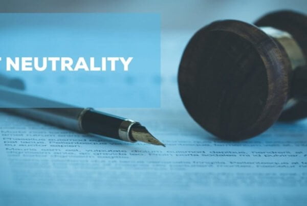 fountain pen and gavel on top of a paper